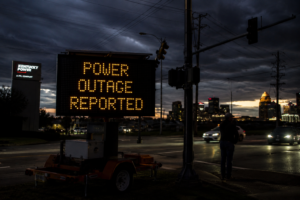 US power outages 2026 showing blackout, damaged power lines and utility crews restoring electricity after severe storms